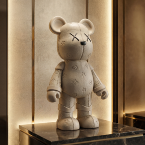 Atelier Home™ The LV Bear™ plush teddy bear with designer-style LV-inspired logo and soft, textured fabric.